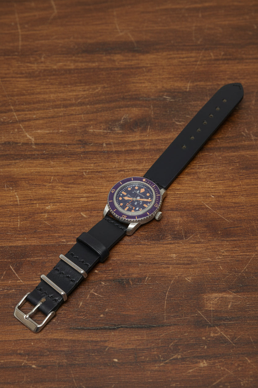 Defcon Artillery black chromexcel watch strap with two stationary metal keepers and one floating leather keeper. 